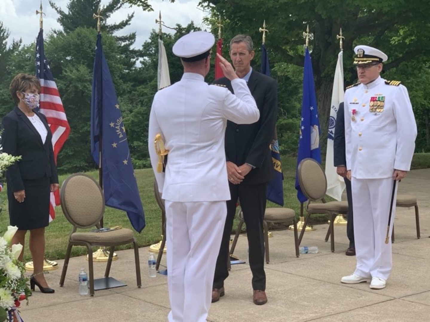 Captain Duncan McKay became the Commanding Officer (CO) of Naval Surface Warfare Center, Crane Division (NSWC Crane) in a ceremony at NSWC Crane on July 1, 2020. Left to right:  Ms. Tricia Herndon, NSWC Crane Technical Director (Acting); CAPT Duncan McKay, NSWC Crane Commanding Officer; Dr. Brett Seidle, Executive Director, NAVSEA Warfare Centers; and CAPT Mark Oesterreich, Former NSWC Crane Commanding Officer.