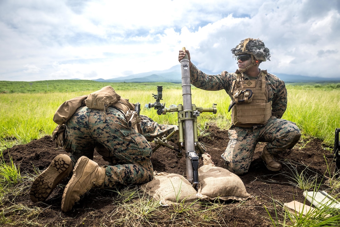 U.S. Marines fire a round from a 61mm mortar during a live-fire range on Combined Arms Training Center Fuji, Japan, June 15.