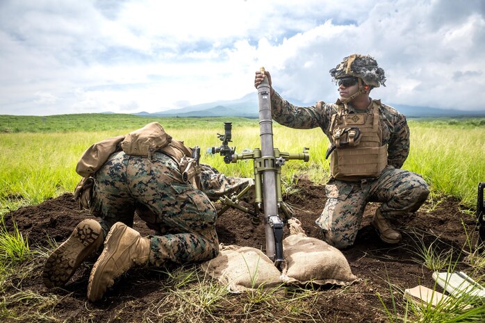 U.S. Marines fire a round from a 61mm mortar during a live-fire range on Combined Arms Training Center Fuji, Japan, June 15.