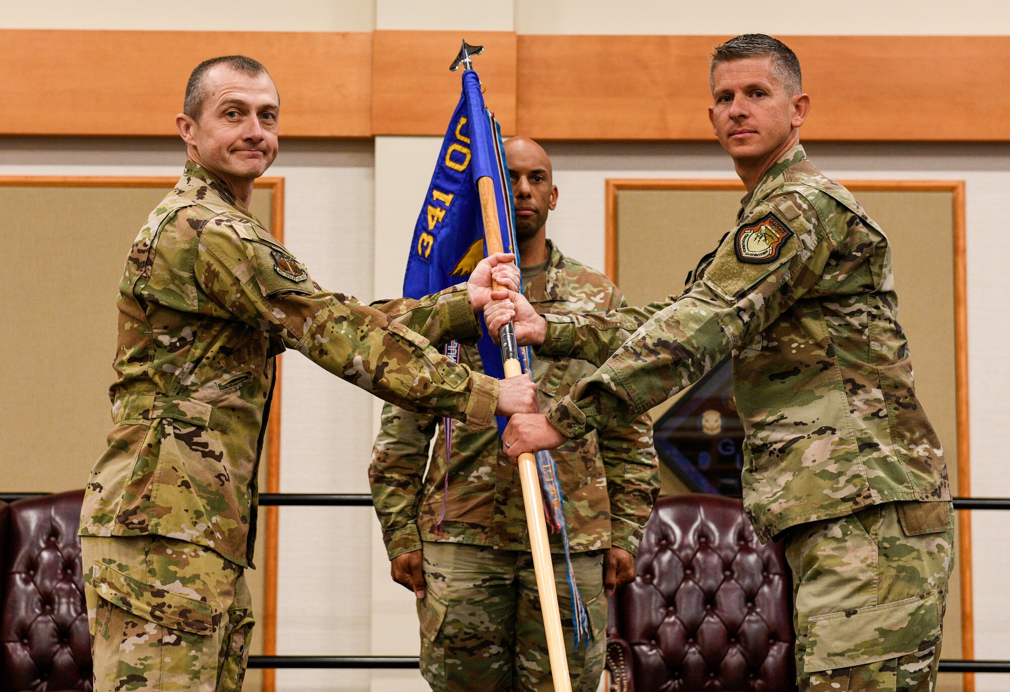 Lt. Col. Aaron Baum, right, accepts command of the 12th Missile Squadron from Lt. Col. Kevin Byrd, 341st Operations Group deputy commander during a change of command ceremony June 30, 2020, at  Malmstrom Air Force Base, Mont.