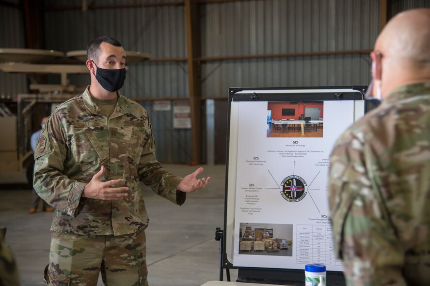 Capt. Anthony Alt, left, 704th Test Support Squadron director of operations, briefs Gen. Arnold W. Bunch Jr., Air Force Materiel Command commander, June 29, 2020, at the 704th Test Group on Holloman Air Force Base, N.M. Bunch’s tour included meeting with various Airmen across the installation in order to see how units remained resilient and successful despite challenges derived from the global pandemic. (U.S. Air Force photo by Senior Airman Collette Brooks)