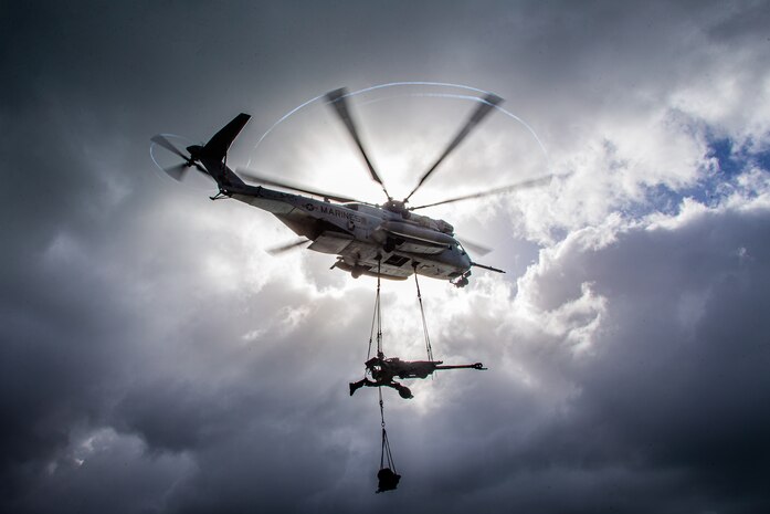 U.S. Marines fly with an M777 Howitzer during a hoist lift exercise alongside Marines from Combat Logistics Battalion 3 and 1st Battalion, 12th Marine Regiment on Marine Corps Base Hawaii, June 18.
