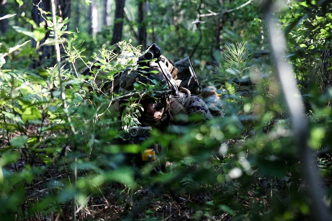 A U.S. Marine posts security during an airfield assault and seizure simulation at Marine Corps Outlying Landing Field, Camp Davis, N.C., June 9.