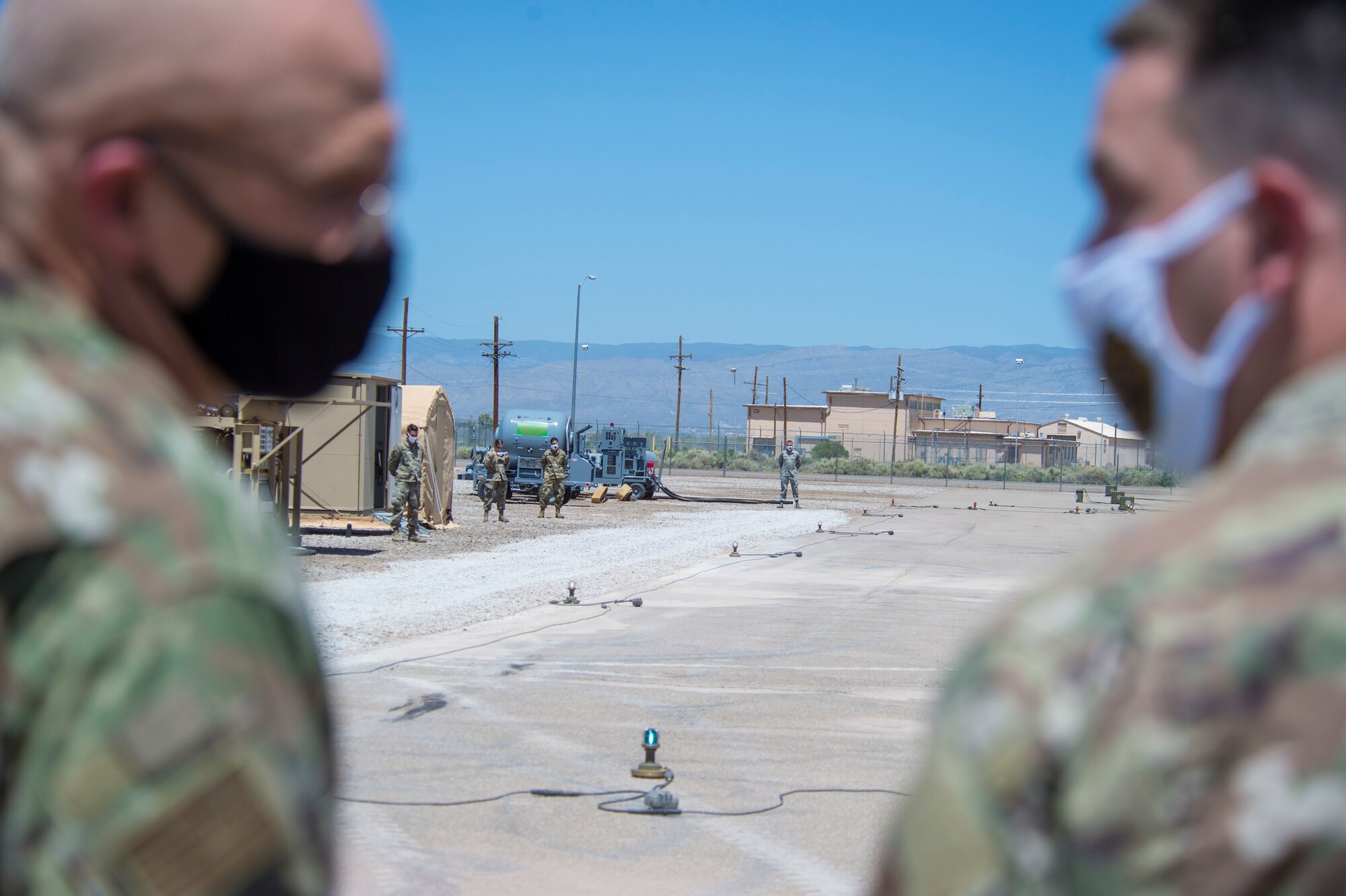 Airmen with the 635th Materiel Maintenance Group wait to give Gen. Arnold W. Bunch Jr., Air Force Materiel Command commander, a tour of Basic Expeditionary Airfield Resources Base, June 29, 2020, on Holloman Air Force Base, N.M. Bunch’s tour included meeting with various Airmen across the installation to see how their mission remained successful despite challenges derived from the global COVID- 19 pandemic. (U.S. Air Force photo by Senior Airman Collette Brooks)