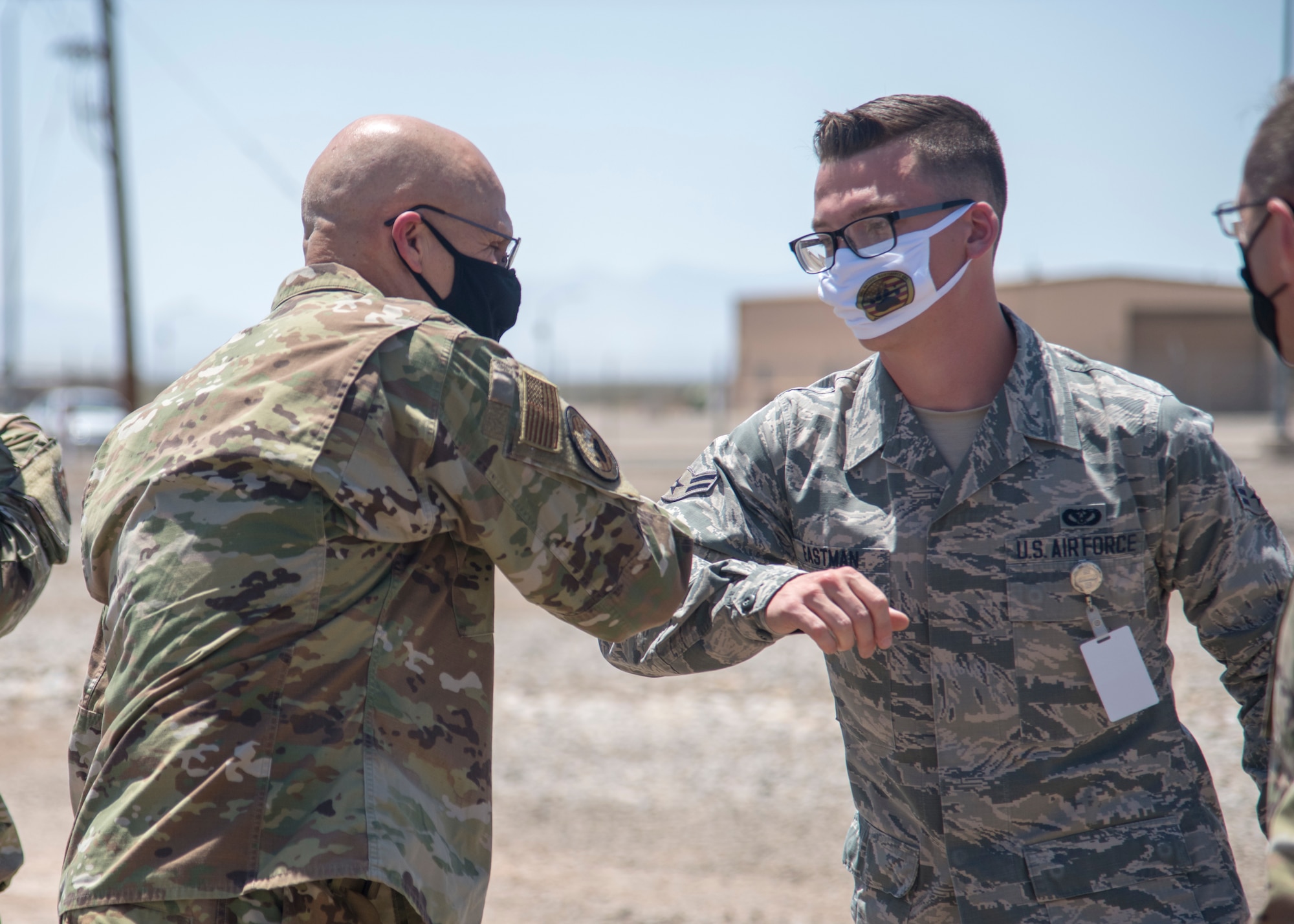Gen. Arnold W. Bunch Jr., left, Air Force Materiel Command commander, bumps elbows with Airman 1st Class Jonah Eastman, 635th Materiel Maintenance Squadron electrical power-production journeyman, during Bunch’s Basic Expeditionary Airfield Resources Base tour, June 29, 2020, at the 635th Materiel Maintenance Group on Holloman Air Force Base, N.M. Bunch’s tour included meeting with various Airmen across the installation in order to see how units remained resilient and successful despite challenges derived from the global COVID-19 pandemic. (U.S. Air Force photo by Senior Airman Collette Brooks)