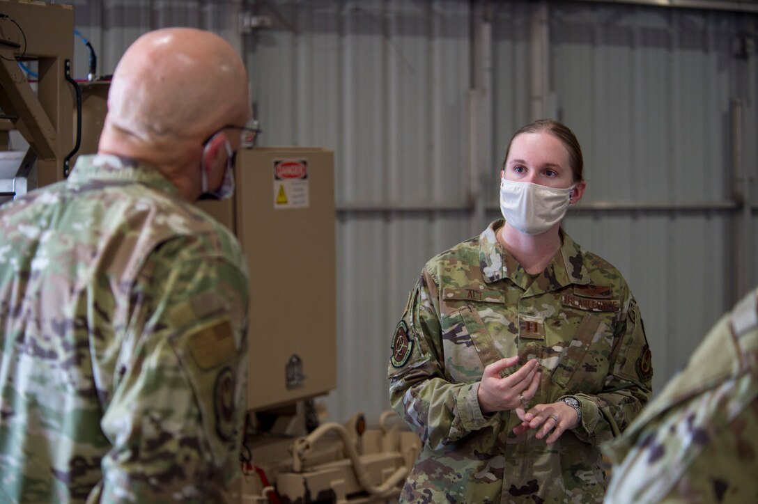 Capt. Erin Alt, right, 746th Test Squadron test management deputy flight chief, briefs Gen. Arnold W. Bunch Jr., Air Force Materiel Command commander, June 29, 2020, at the 704th Test Group on Holloman Air Force Base, N.M. Alt briefed Bunch on her 24-member flight who are responsible for GPS and inertial navigation test planning and execution, supporting approximately 50 programs annually. (U.S. Air Force photo by Senior Airman Collette Brooks)