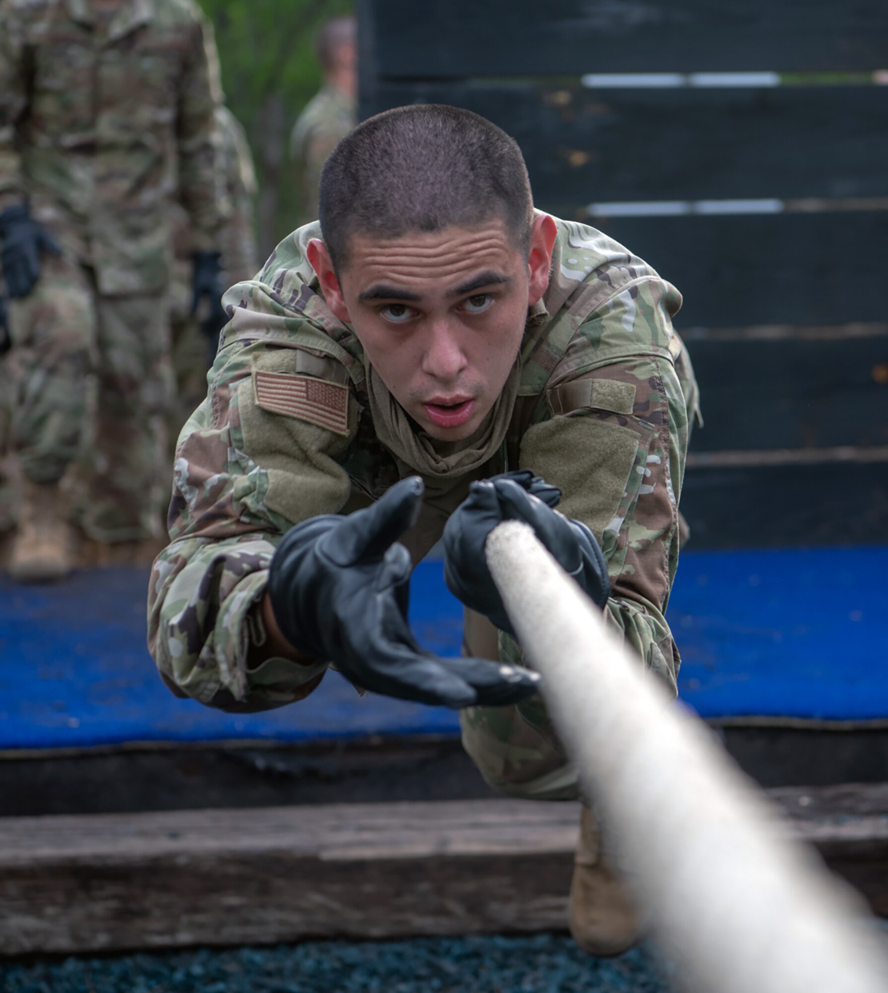 Daniel Hughes, U.S. Air Force basic training trainee, runs through an obstacle course May 21 at Joint Base San Antonio-Chapman Annex.