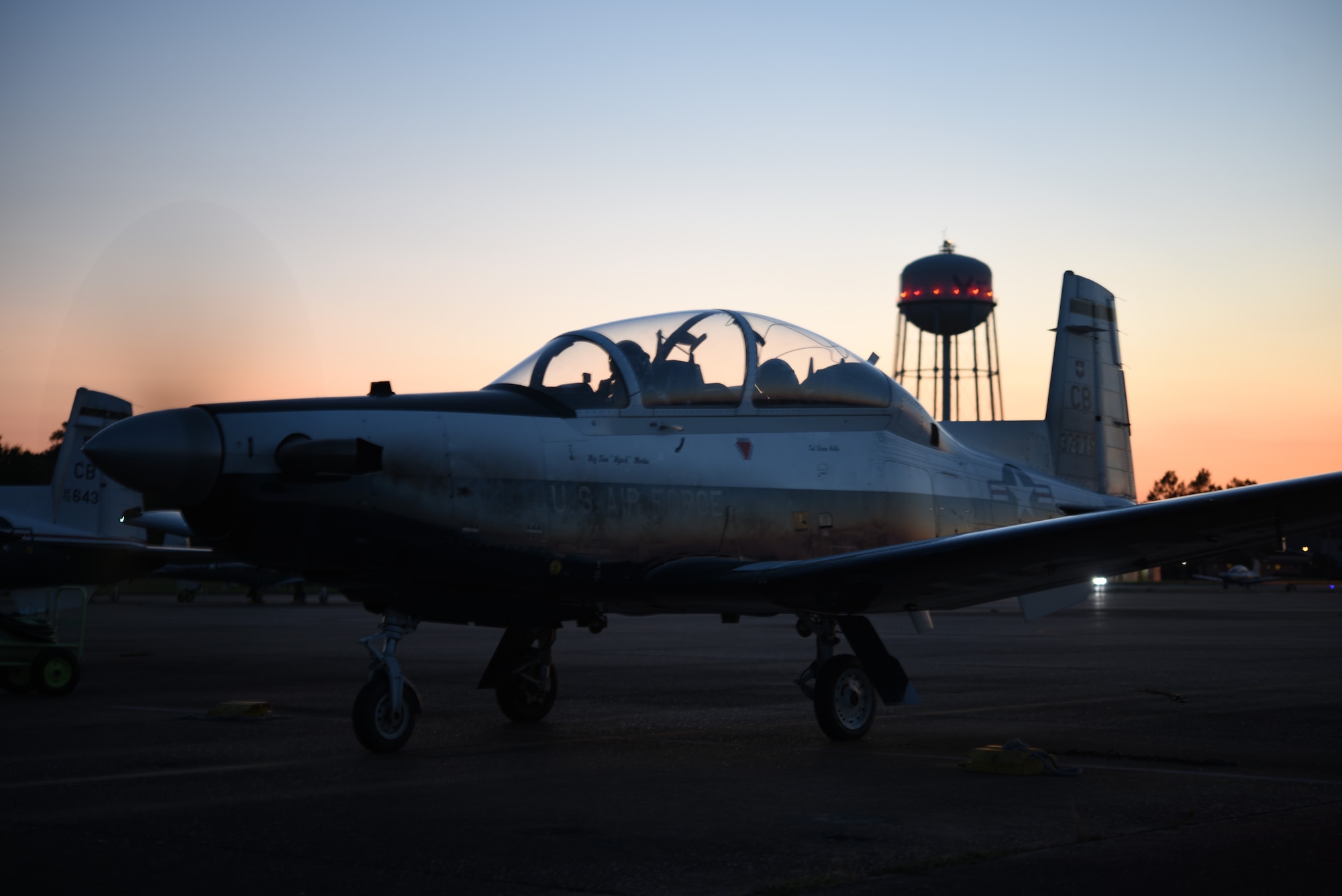 A student and instructor pilot ready a T-6 Texan II before takeoff at Columbus Air Force Base, Miss. In PIT, these future instructor pilots are trained to teach precise maneuvers in the T-6 Texan II, T-1 Jayhawk, or T-38 Talon. (U.S. Air Force photo by Senior Airmen Keith Holcomb)