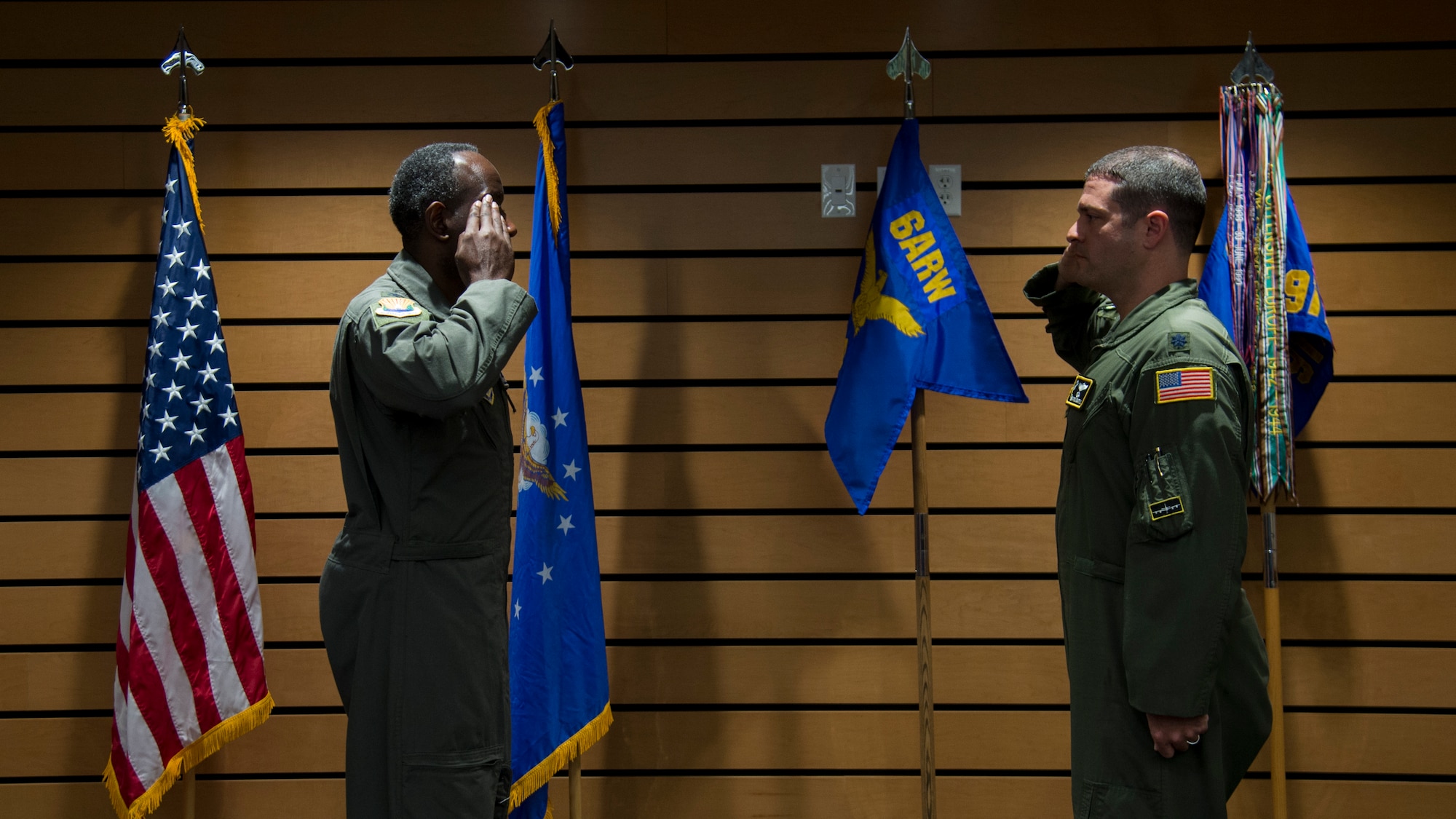 U.S. Air Force Col. Travis Edwards, the 6th Air Refueling Wing vice commander salutes Lt. Col. Ivan Blackwell, the 91st Air Refueling Squadron commander during a change of command ceremony, June 5, 2020, at MacDill Air Force Base, Fla