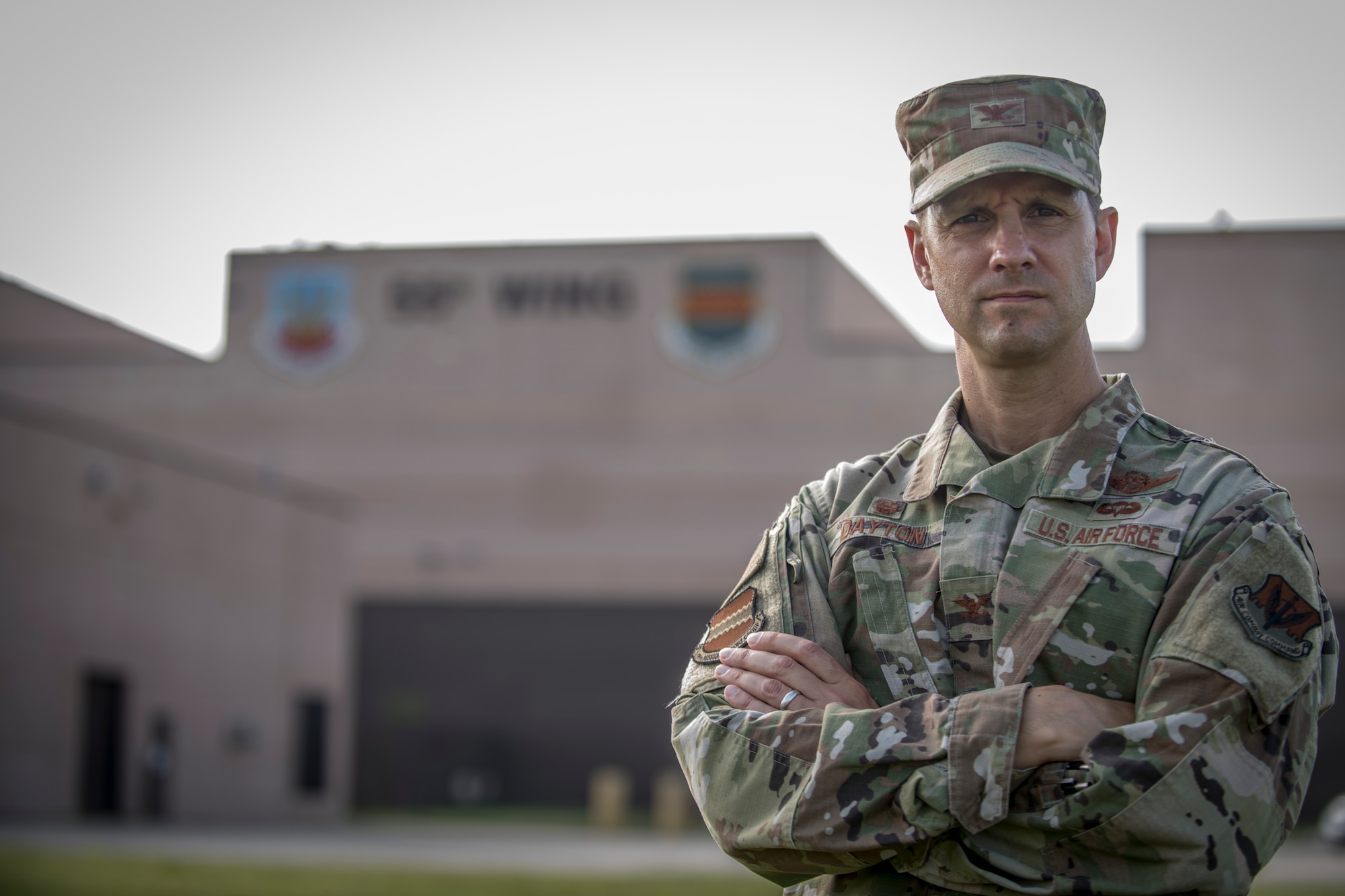 Military member stands in front of Building D