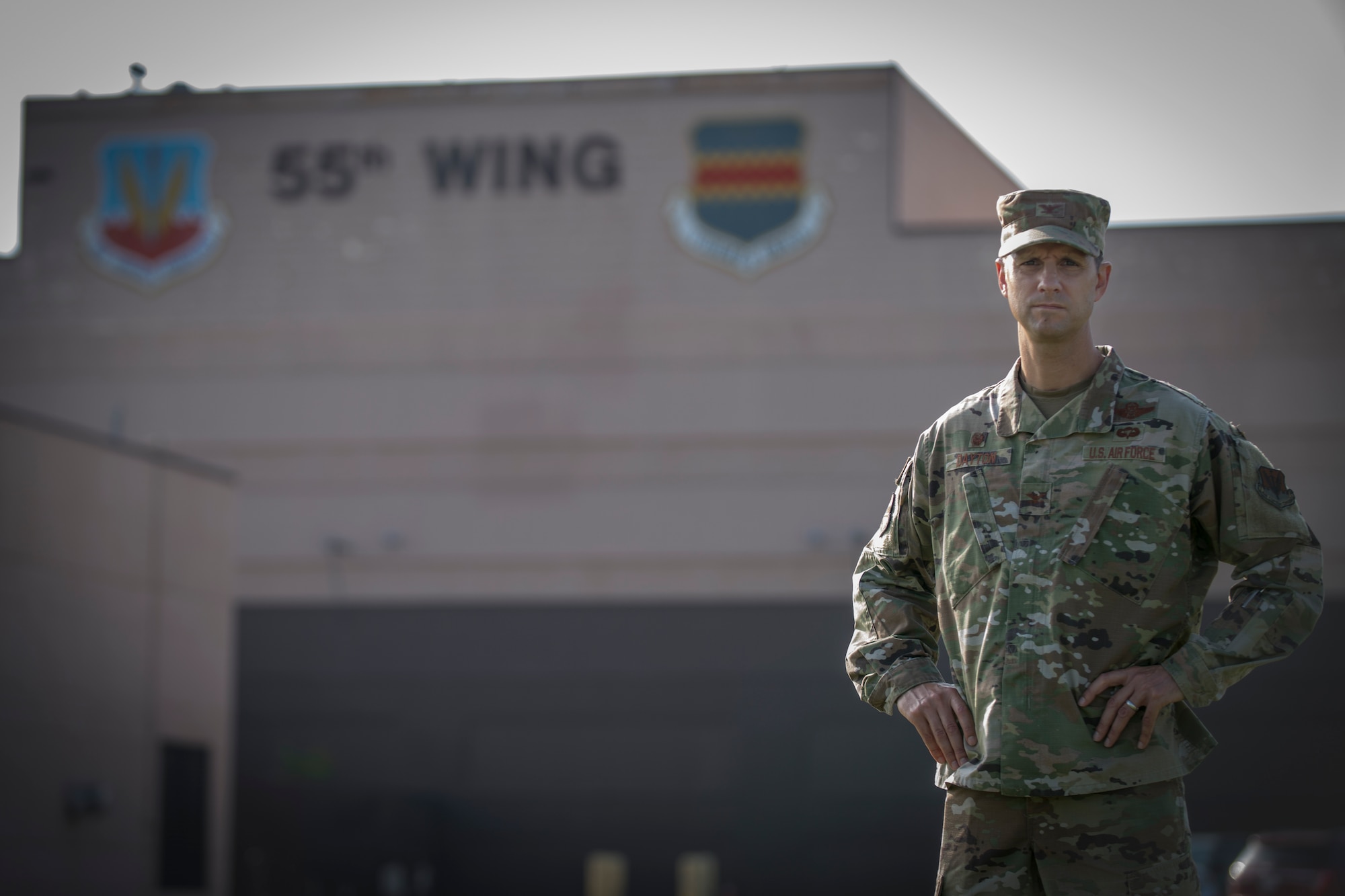 Military member stands in front of Building D