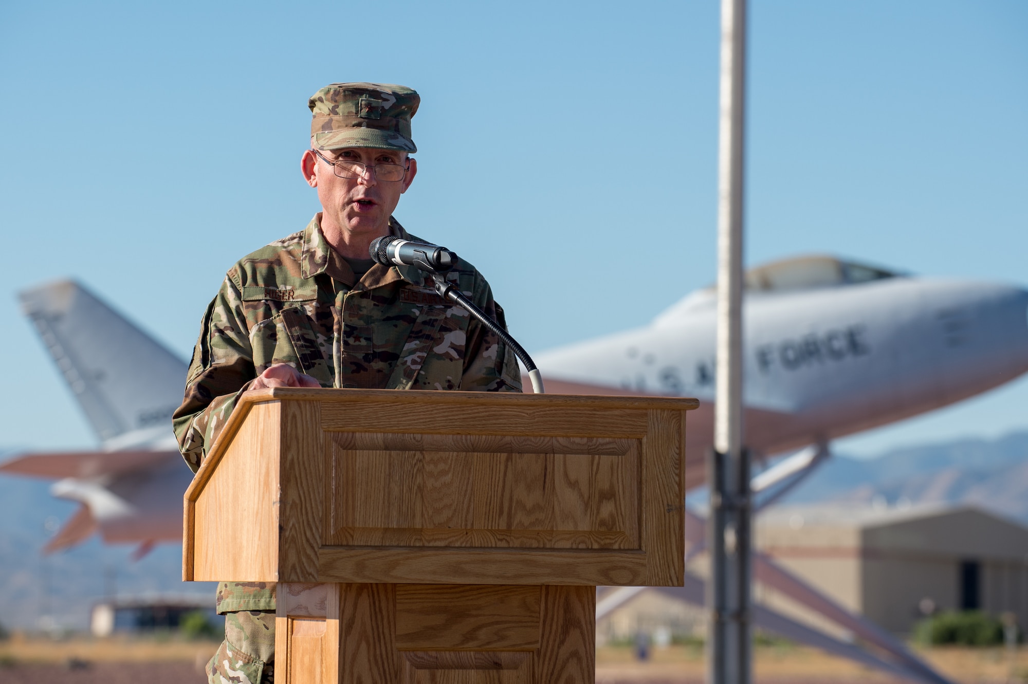 Brig. Gen. Matthew Higer, 412th Test Wing Commander, provides remarks during a Change of Leadership Ceremony between Col. Dwayne Robison and Dr. David Smith at Operating Location Air Force Plant 42, in Palmdale, California, July 1. (Air Force photo by Ethan Wagner)