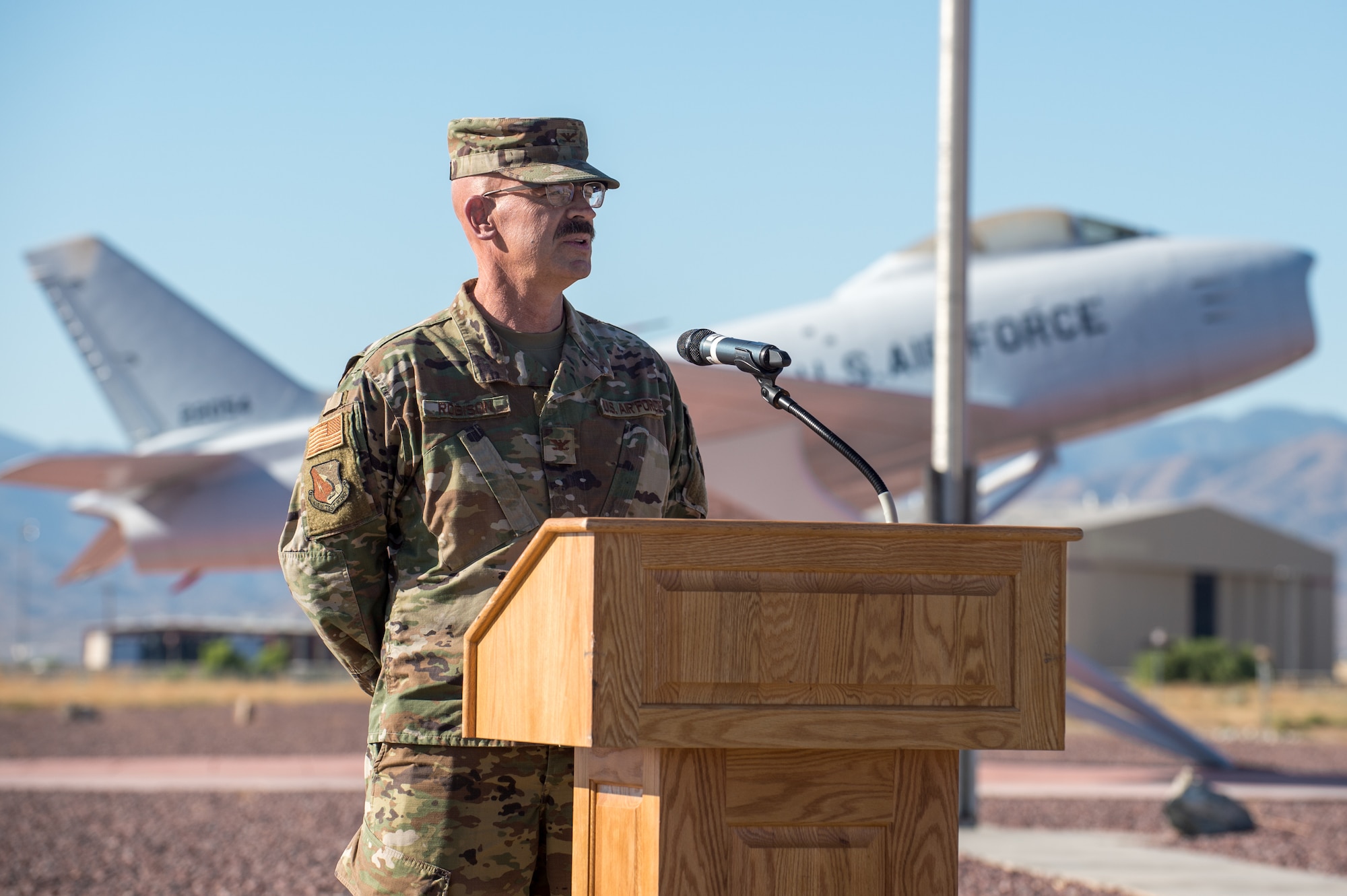 Col. Dwayne Robison, the outgoing Operating Location Air Force Plant 42 Director, provides his remarks during a Change of Leadership Ceremony between Robison and Dr. David Smith at Plant 42, in Palmdale, California, July 1. (Air Force photo by Ethan Wagner)