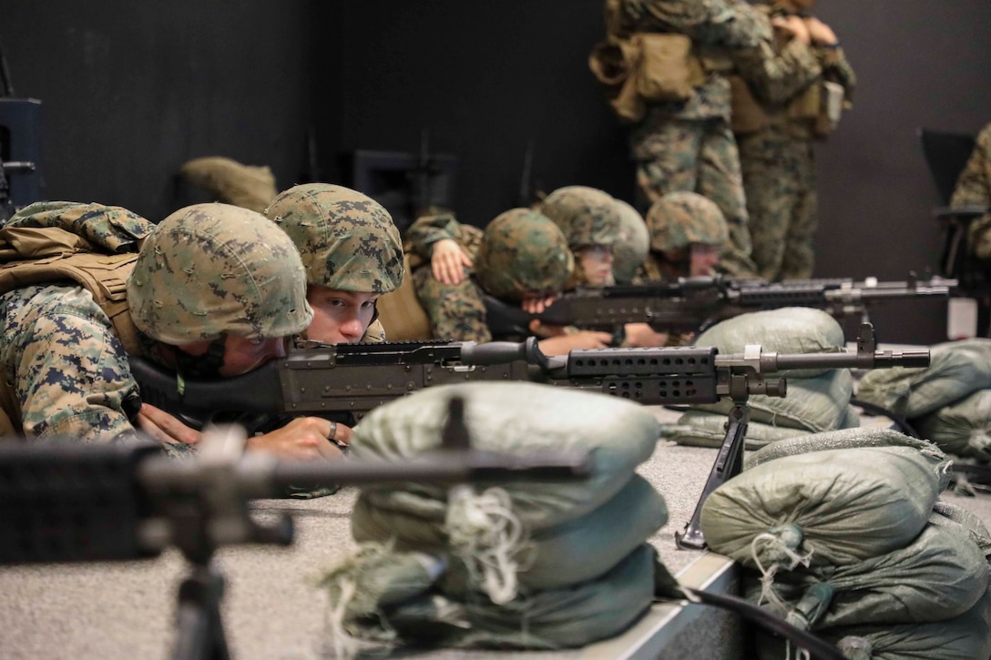 Enlisted Marines from U.S. Marine Corps Forces Korea participated in an enlisted-specific training day event on 26 June 2020. During the training, the Marines utilized the Engagement Skills Trainers aboard USAG Humphreys and got a hands-on Tactical Combat Casualty Care class in which they reviewed how to properly apply a tourniquet under stressful circumstances. The Marines also utilized simulated M240 Bravo machineguns while being taught weapon's functions and how to operate the crew served weapon. This training helps Marines maintain readiness and answer the call to Fight Tonight! (U.S. Marine Corps Photo by Sgt. Parker R. Golz)