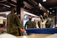 Maj. Vincent Giacomino (right) briefs Col. Tyler R. Schaff (center), 316th Wing and Joint Base Andrews commander, and Col. Stephen P. Snelson (left), 89th Airlift Wing commander, on the SparkX Cell program and its mission during an immersion tour at the SparkX Cell Innovation and Idea Center, Joint Base Andrews, Md., on June 29, 2020.