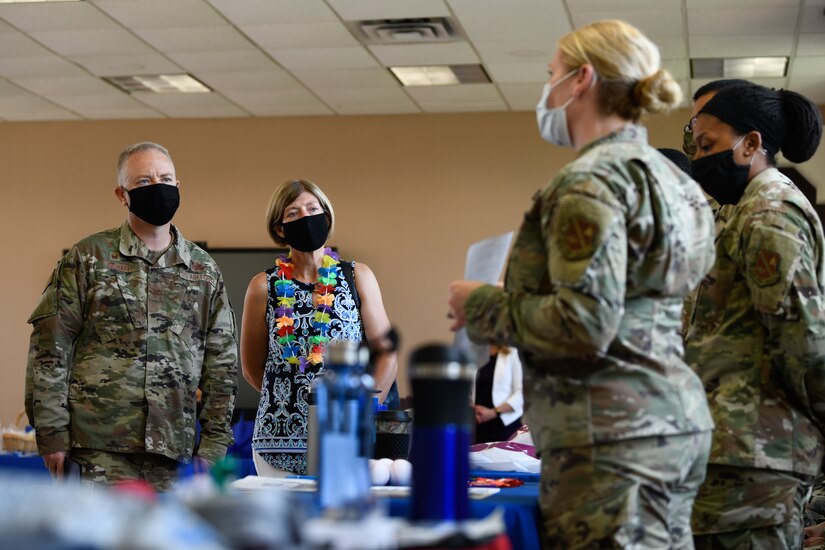 Col. Tyler R. Schaff, 316th Wing and Joint Base Andrews commander, and his wife, Ellen Schaff, attend a briefing about suicide awareness during an immersion tour at Chapel One on Joint Base Andrews, Md., on June 29, 2020.