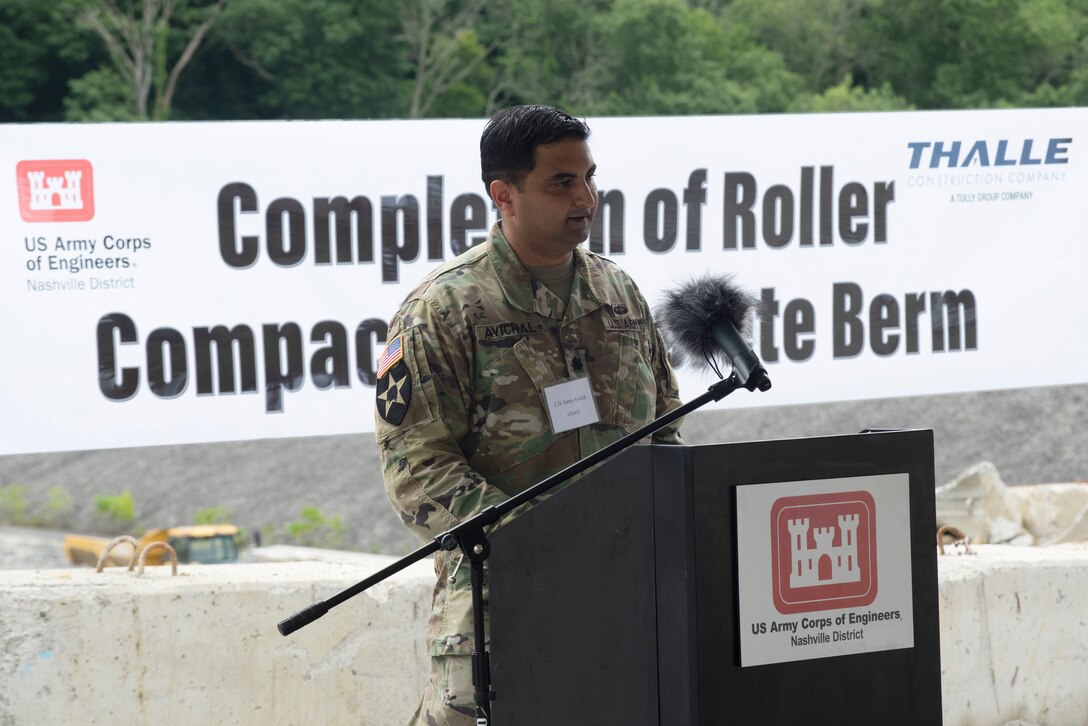 Lt. Col. Sonny Avichal, U.S. Army Corps of Engineers Nashville District commander, addresses guests at the Center Hill Lake Auxiliary Dam July 1, 2020 during a ceremony celebrating the completion of the last phase of repairs for the $353 million Center Hill Dam Safety Rehabilitation Project. The U.S. Army Corps of Engineers Nashville District recently finished constructing a roller compacted concrete berm to reinforce the auxiliary dam at Center Hill Lake, a secondary earthen embankment that fills a low area in the landscape just east of the main dam. (USACE Photo by Lee Roberts)
