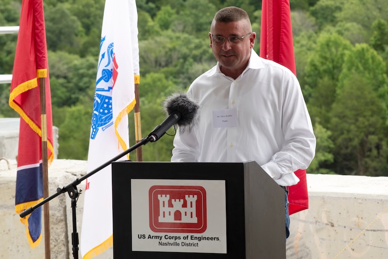 Steve Kohler, president and chief executive officer of Thalle Construction Corporation, speaks about the technical processes of constructing a roller compacted concrete berm and challenges the contractor faced and overcame during a ceremony July 1, 2020 in Silver Point, Tennessee, celebrating the completion of the $50 million RCC berm that stabilizes the left rim of Center Hill Lake and reduces risk of both an internal erosion foundation failure and a potential overtopping failure mode at the saddle dam. (USACE Photo by Lee Roberts)