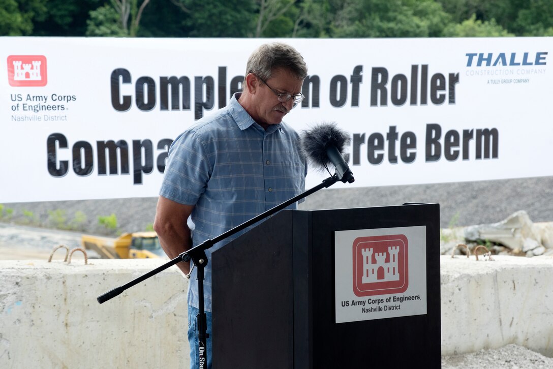 Corps of Engineers Retiree Tony Crow gives the invocation July 1, 2020 to a ceremony celebrating the completion of the last phase of repairs for the $353 million Center Hill Dam Safety Rehabilitation Project. The U.S. Army Corps of Engineers Nashville District recently finished constructing a roller compacted concrete berm to reinforce the auxiliary dam at Center Hill Lake, a secondary earthen embankment that fills a low area in the landscape just east of the main dam. (USACE Photo by Lee Roberts)