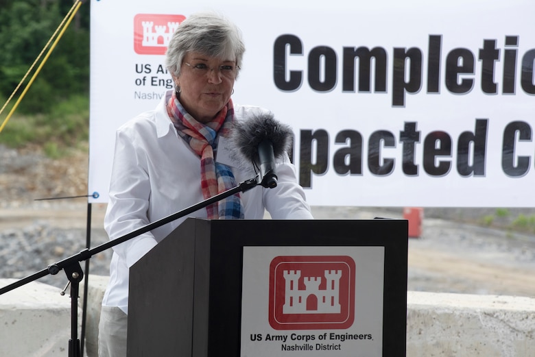 Patty Coffey, deputy district engineer for the U.S. Army Corps of Engineers Nashville District and master of ceremonies, welcomes guests July 1, 2020 to a ceremony celebrating the completion of the last phase of repairs for the $353 million Center Hill Dam Safety Rehabilitation Project. The U.S. Army Corps of Engineers Nashville District recently finished constructing a roller compacted concrete berm to reinforce the auxiliary dam at Center Hill Lake, a secondary earthen embankment that fills a low area in the landscape just east of the main dam. (USACE Photo by Lee Roberts)