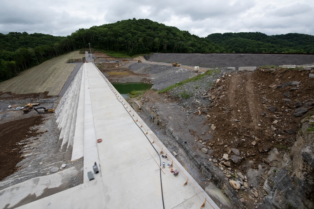 Officials held a ceremony July 1, 2020 to celebrate the completion of the last phase of repairs for the $353 million Center Hill Dam Safety Rehabilitation Project.  The U.S. Army Corps of Engineers Nashville District recently finished constructing a roller compacted concrete berm to reinforce the auxiliary dam at Center Hill Lake, a secondary earthen embankment that fills a low area in the landscape just east of the main dam. Construction of the $50 million RCC Berm completes the final major construction contract to remediate the Center Hill project. (USACE Photo by Lee Roberts)