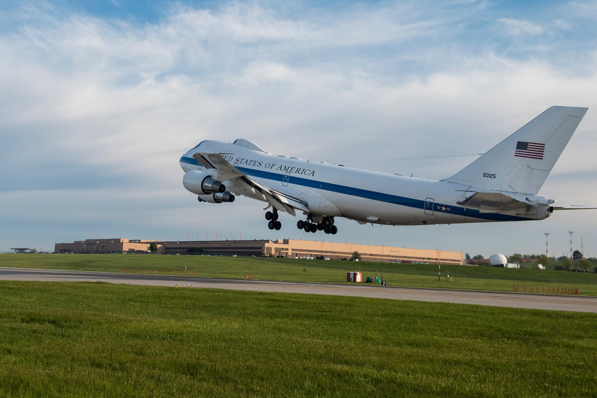 An E-4B takes off over Building D
