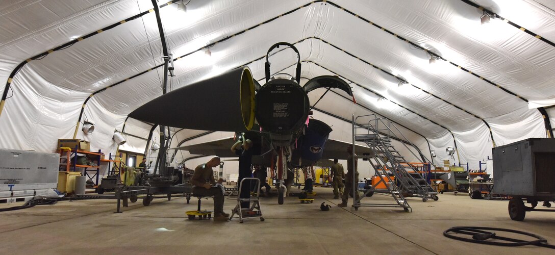 .S. Air Force aircraft maintenance Airmen from the 378th Expeditionary Maintenance Squadron execute aircraft maintenance inspection on an F-15C Eagle aircraft at Prince Sultan Air Base, Kingdom of Saudi Arabia, June 30, 2020.