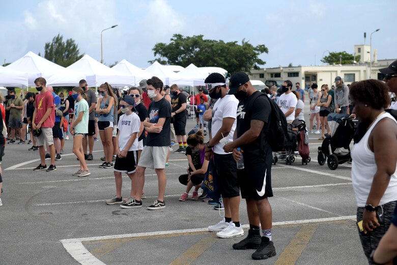 Team Kadena members take a moment of silence before the Walk for Unity 5K at Kadena Air Base, Okinawa, Japan, June 20, 2020. The event signified Team Kadena’s commitment to bringing the community together and resolving racial divides and inequalities in our nation and Air Force. (U.S. Air Force photo by Staff Sgt. Daryn Murphy)