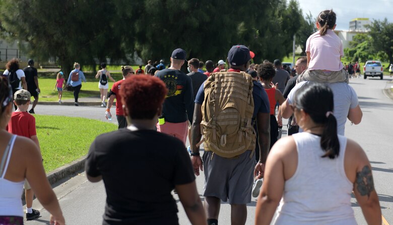 Service members, civilians, contractors and families participate in Team Kadena Walk for Unity 5K at Kadena Air Base, Okinawa, Japan, June 20, 2020. The event signified Team Kadena’s commitment to bringing the community together and resolving racial divides and inequalities in our nation and Air Force. (U.S. Air Force photo by Staff Sgt. Daryn Murphy)