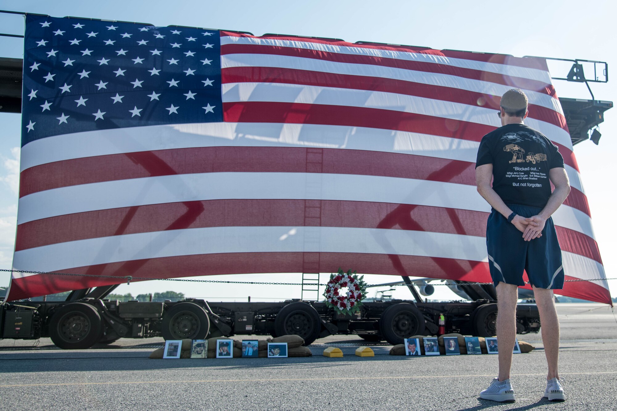 Lt. Col. Lawrence Smith, 436th Aerial Port Squadron commander, awaits the start of the annual Port Dawg Memorial 5K to honor fallen Port Dawgs June 29, 2020, at Dover Air Force Base, Delaware. Smith has led the past four runs as commander of the squadron, but this is his last one. (U.S. Air Force photo by Airman 1st Class Faith Schaefer)