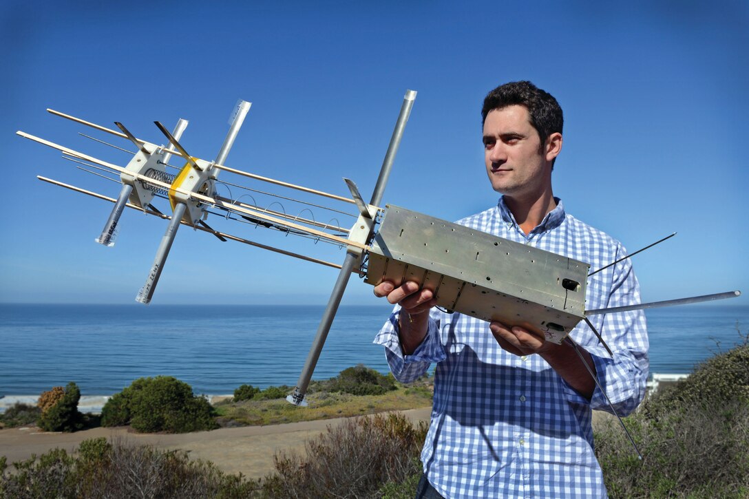 IMAGE: SAN DIEGO (April 3, 2014) - Kyle Lackinger, electrical engineer,running tests on the ICE-Cap satellite systems at the Space and Naval Warfare Systems Center Pacific. Lackinger won the Technology to the Warfighter Award for leadership impacting new radar and laser technologies deployed to the fleet, Naval Surface Warfare Center Dahlgren Division officials announced July 1. (Photo by Alan Antczak/released)