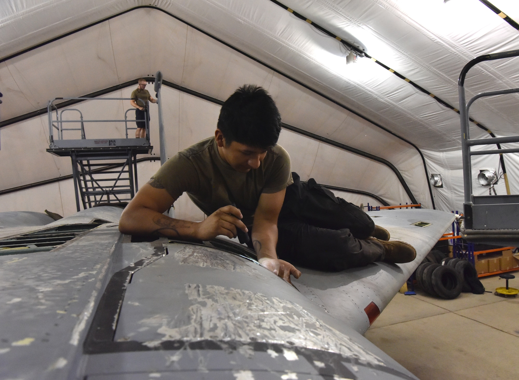 .S. Air Force aircraft maintenance Airmen from the 378th Expeditionary Maintenance Squadron execute aircraft maintenance inspection on an F-15C Eagle aircraft at Prince Sultan Air Base, Kingdom of Saudi Arabia, June 30, 2020.