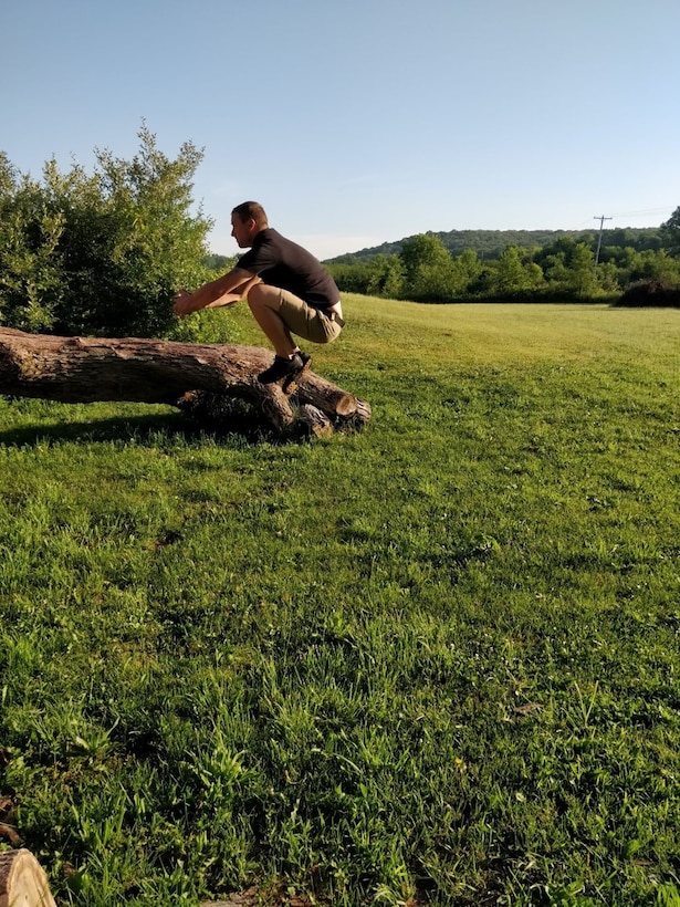 Dan Roberts demonstrates a jump used as part of the 8-week virtual fitness challenge.