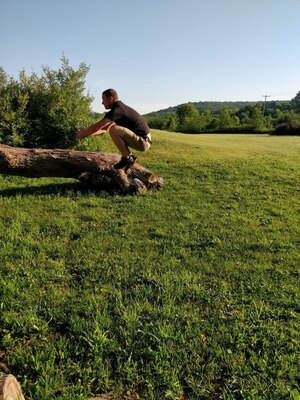 Dan Roberts demonstrates a jump used as part of the 8-week virtual fitness challenge.