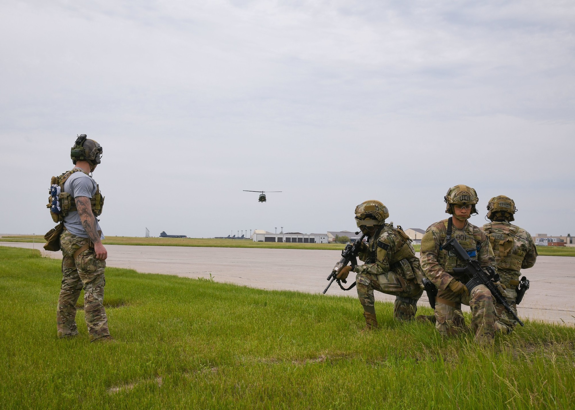 Team Minot Airmen prepare to board a helicopter June 16, 2020, at Minot Air Force Base, North Dakota. Helicopter boarding and exiting is a main part of Team Minot’s Tactical Response Force’s mission. (U.S. Air Force Photos By Airman 1st Class Caleb S. Kimmell)