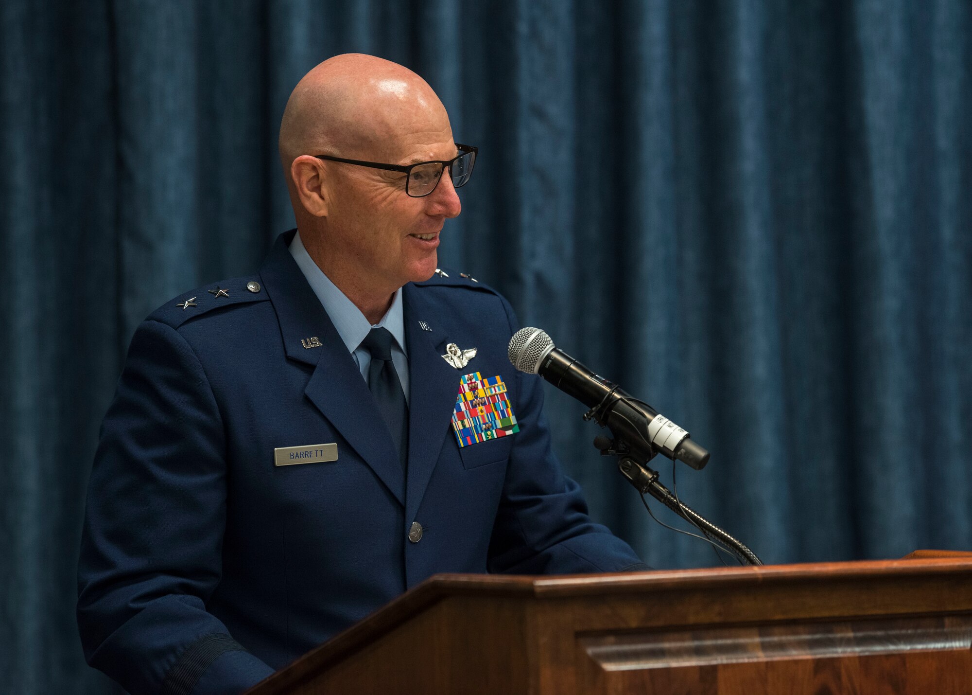 U.S. Air Force Maj. Gen. Sam Barrett, 18th Air Force commander, gives a speech during the 92nd Air Refueling Wing change of command ceremony