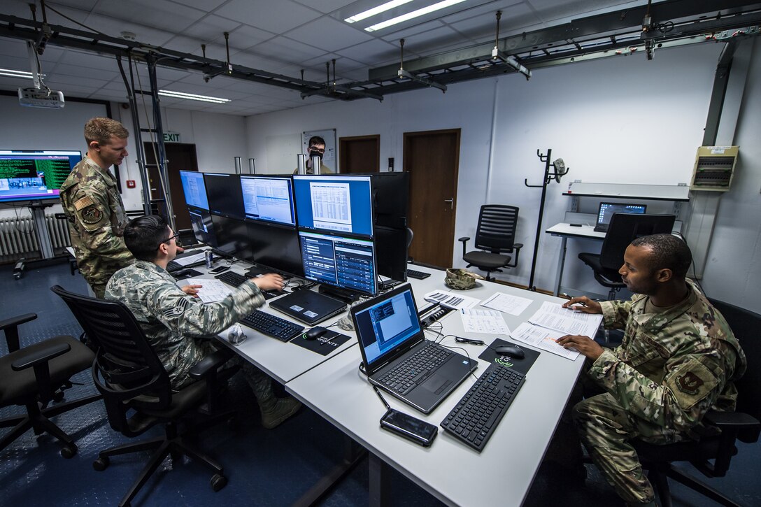 Photo of Airmen using computer