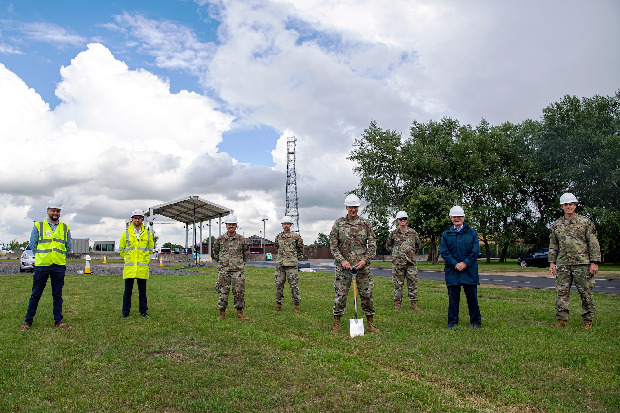 U.S. Air Force Col. Christopher J. Bromen (center), 423d Air Base Group commander, breaks ground on a construction project for the main gate at RAF Alconbury, England, July 2, 2020. This project will provide a large vehicle inspection station, channelized traffic flow for better security and improved safety for personnel. Construction will officially commence on July 6, 2020 and effective from that date, installation entry and exit procedures will be modified to support the construction project. (U.S. Air Force photo by Senior Airman Eugene Oliver)