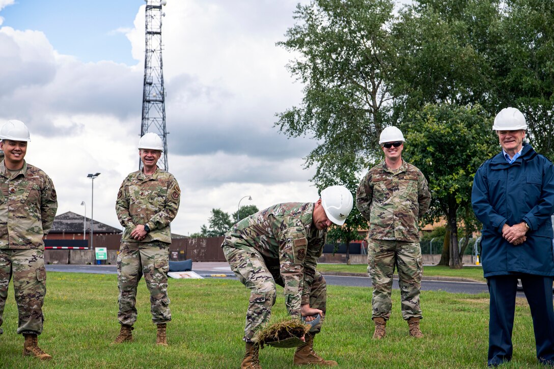 U.S. Air Force Col. Christopher J. Broken (center), 423d Air Base Group commander, breaks ground on a construction project for the main gate at RAF Alconbury, England, July 2, 2020. This project will provide a large vehicle inspection station, channelized traffic flow for better security and improved safety for personnel. Effective July 6, the Stukely Gate will be open 24 hours daily for all outbound traffic. (U.S. Air Force photo by Senior Airman Eugene Oliver)