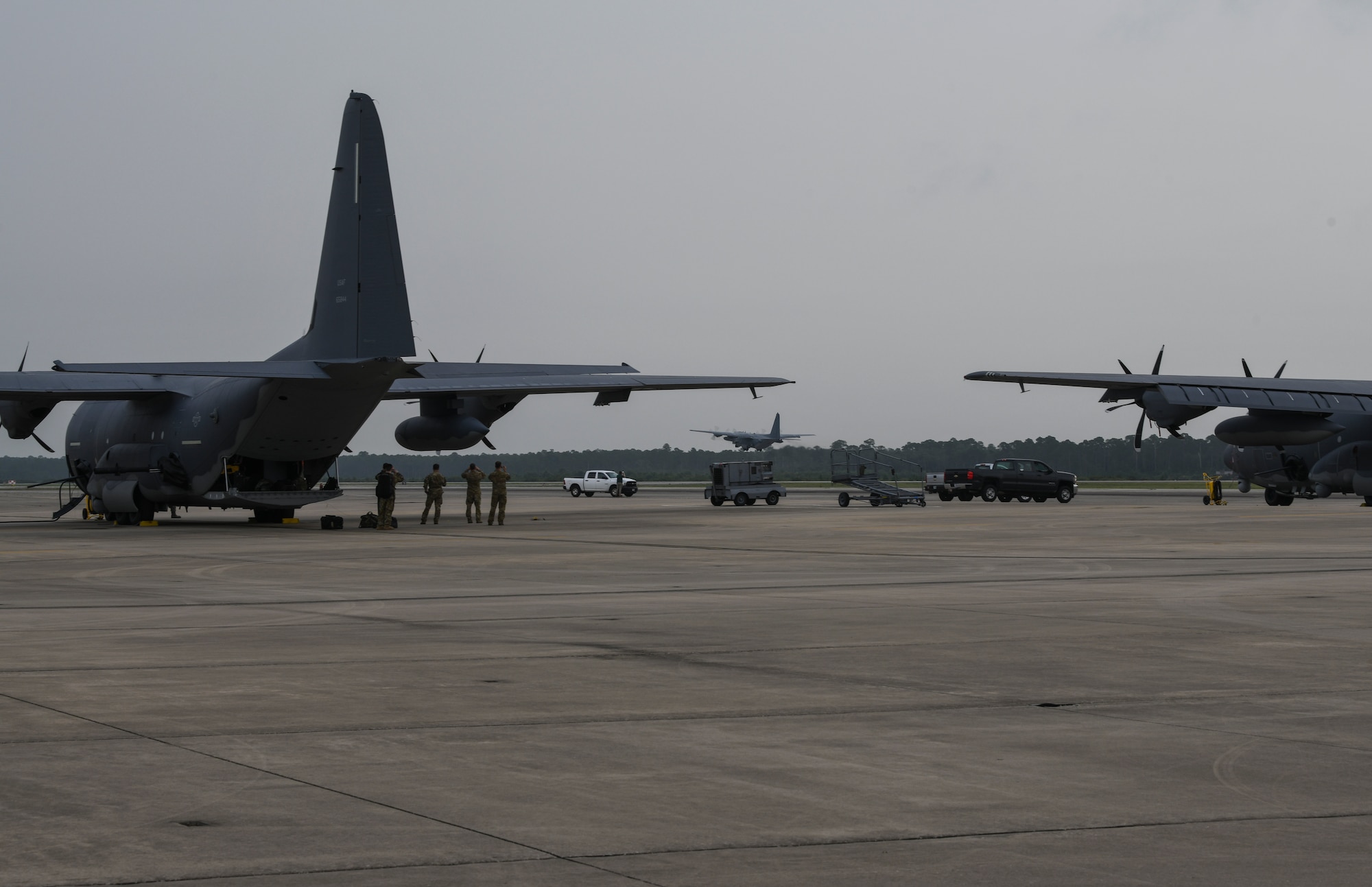 Air Commandos with the 4th Special Operations Squadron and 4th Aircraft Maintenance Unit watch as AC-130U Spooky gunship 0510 takes off for its final flight at Hurlburt Field, Florida, June 26, 2020