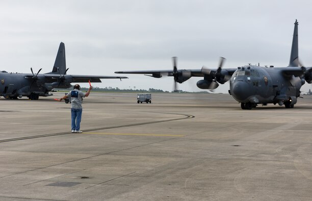 Retired U.S. Air Force Tech. Sgt. Mark Benoit, a crew chief with the 4th Aircraft Maintenance Unit, marshals AC-130U Spooky gunship 0510 out to its last flight at Hurlburt Field, Florida, June 26, 2020