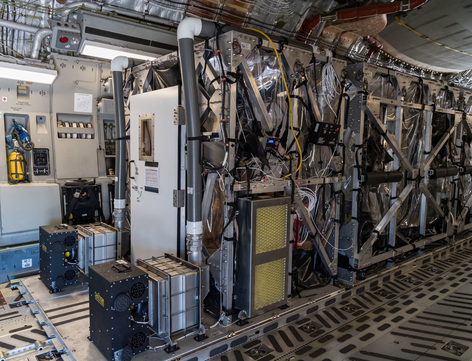 A Transport Isolation System unit used to transport COVID-19 patients is positioned on a C-17 Globemaster III, June 26, 2020, at Dover Air Force Base, Delaware. Two TIS units are located at Dover, which serves as the U.S. East Coast hub due to its location and support facilities. (U.S. Air Force photo by Roland Balik)