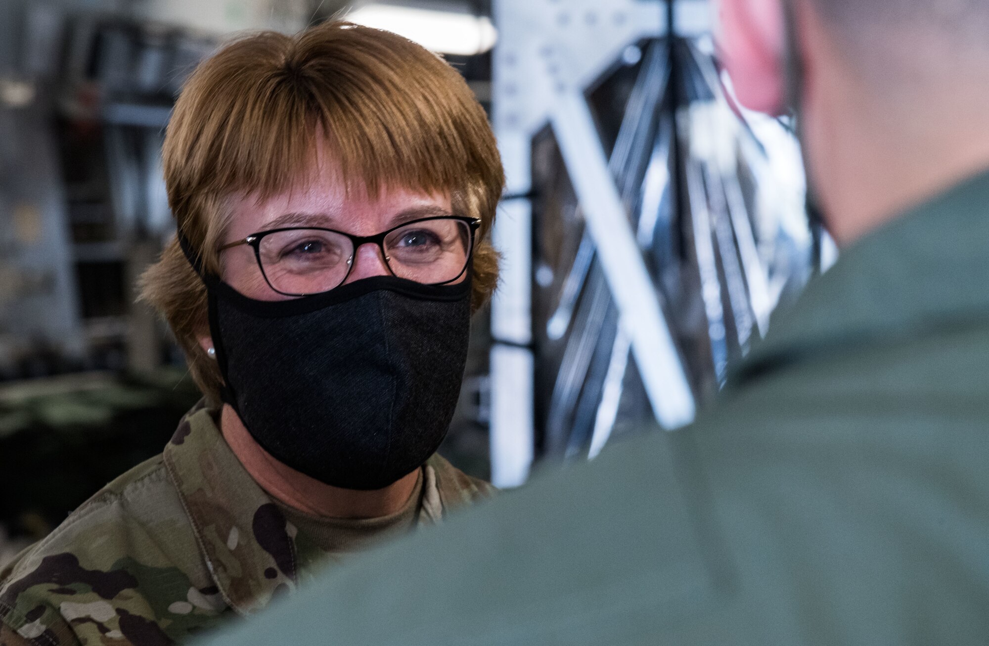 Lt. Gen. Dorothy Hogg, U.S. Air Force surgeon general, speaks with a 10th Expeditionary Aeromedical Evacuation Flight aircrew member June 26, 2020, at Dover Air Force Base, Delaware. Dover serves as the U.S. East Coast hub for the Transport Isolation System. (U.S. Air Force photo by Roland Balik)