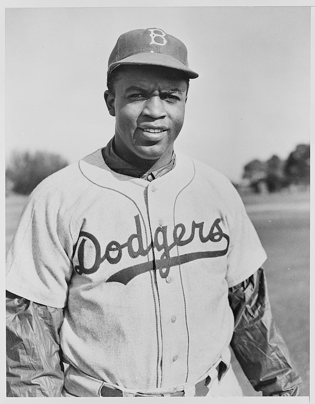 Baseball great Jackie Robinson poses for a photo.