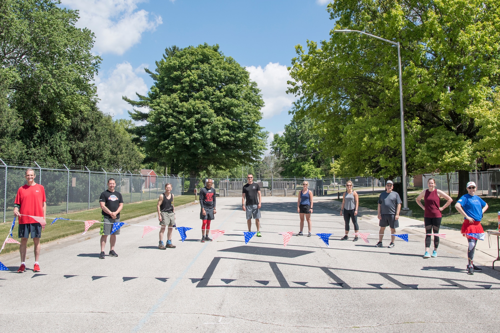 Participants of the Firecracker 5k line up behind the start-line at Grissom Air Reserve Base, Indiana, June 24, 2020. The run was Grissom’s first 5K following the closing of Grissom’s base gym in March due to the COVID-19 pandemic. (U.S. Air Force photo/Master Sgt. Ben Mota)