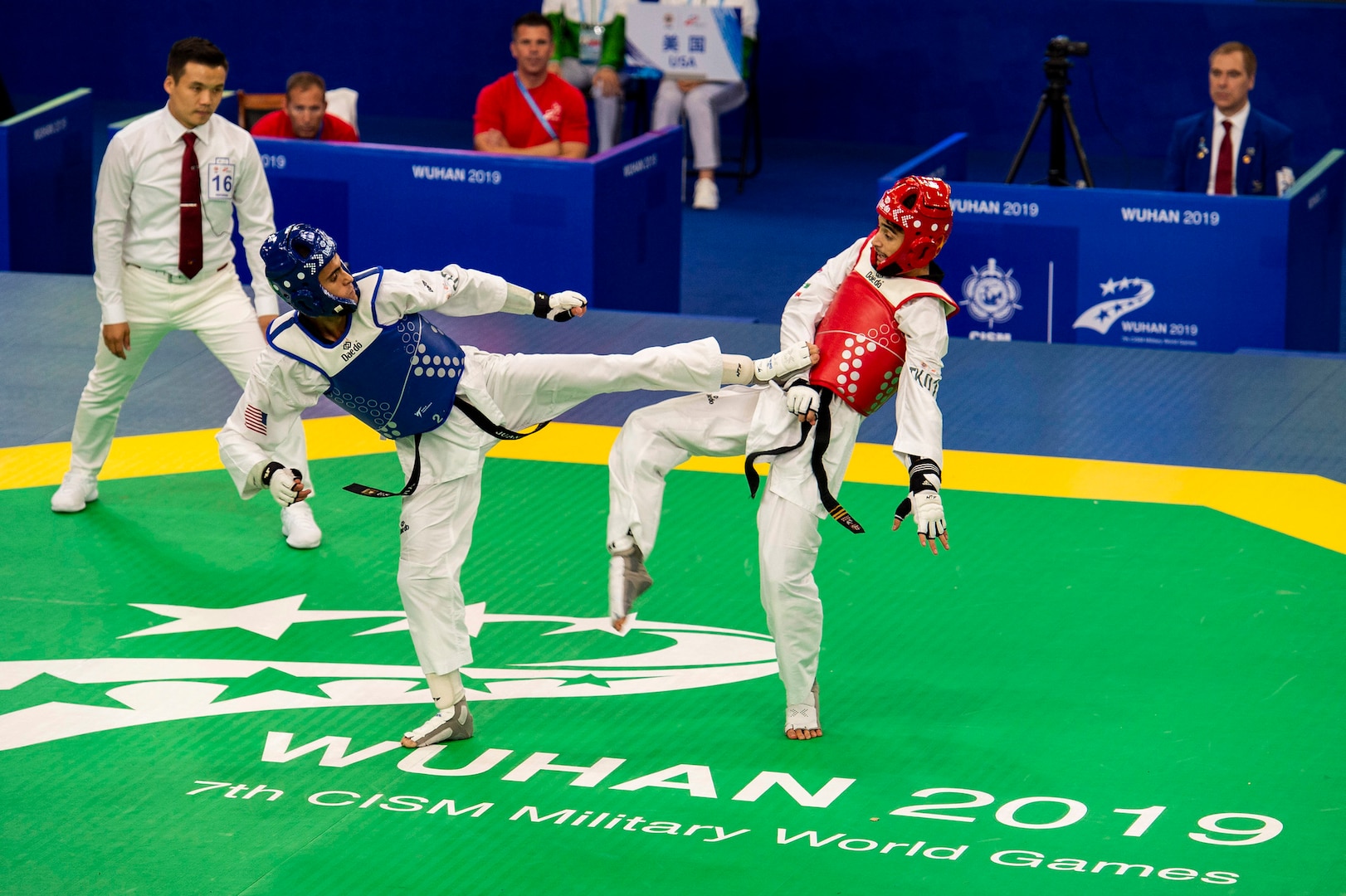 Army Pvt. 2nd Class Juan Carlos Norzagaray-Garcia with the U.S. Armed Forces Taekwondo Team fights Iran's Mahaleh Kalaei Iman at the CISM Military World Games in Wuhan, China, Oct. 26, 2019.  (DoD photo by Mass Communication Specialist 1st Class Ian Carver)