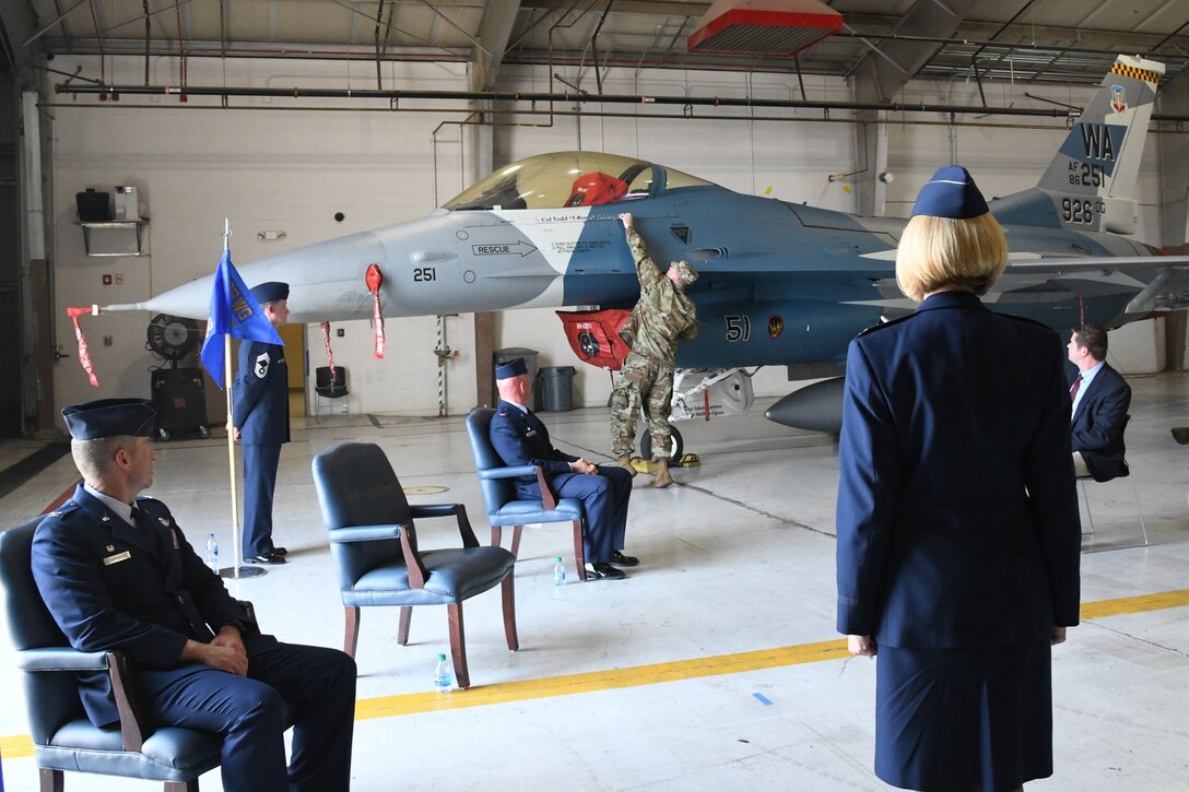 Col. Sheila Wilds accepts command of the 926th Operations Group during a Change of Command ceremony, June 26, 2020 at Nellis Air Force Base, Nevada. During the ceremony Col. Todd Tobergte relinquished command to Wilds. Wilds comes to the 926th OG from the 379th Space Range Squadron, where she served as commander. The COC ceremony was modified to honor the heritage of the passing of the wing guidon while maintaining current social distancing guidelines.