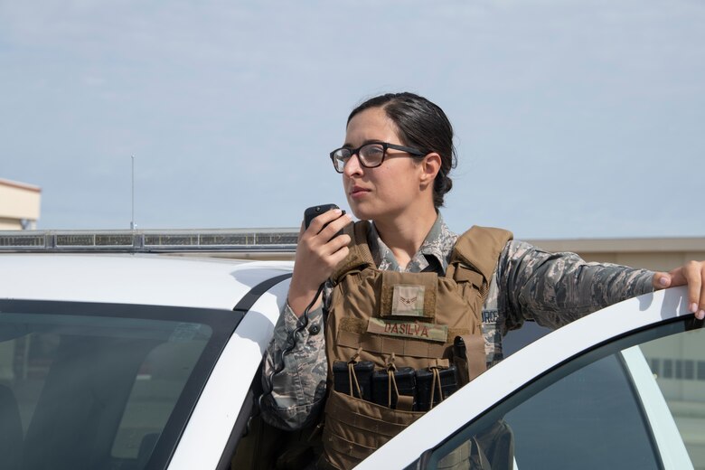 U.S. Air Force Airman 1st Class Stephanie DaSilva, 60th Security Forces Squadron entry controller, provides an update on flight line perimeter checks using a mobile radio May 16, 2020, at Travis Air Force Base, California. DaSilva supports missions for the 60th Air Mobility Wing, 621st Contingency Response Wing and the Air Force Reserve’s 349th Air Mobility Wing. (U.S. Air Force photo by Tech. Sgt. James Hodgman)
