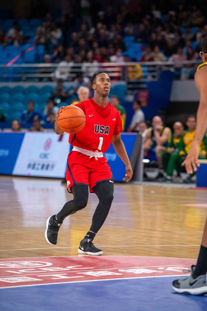U.S. Navy Lt. Junior Grade Tillman Dunbar, III, U.S Armed Forces Men’s Basketball Team member, advances the ball during the 7th Conseil International du Sport Militaire World Games in Wuhan, China Oct. 25, 2019. The U.S. team defeated Brazil 78-61 to advance to the gold medal game against the Lithuania. (U.S. DoD photo by Staff Sgt. Vito T. Bryant)