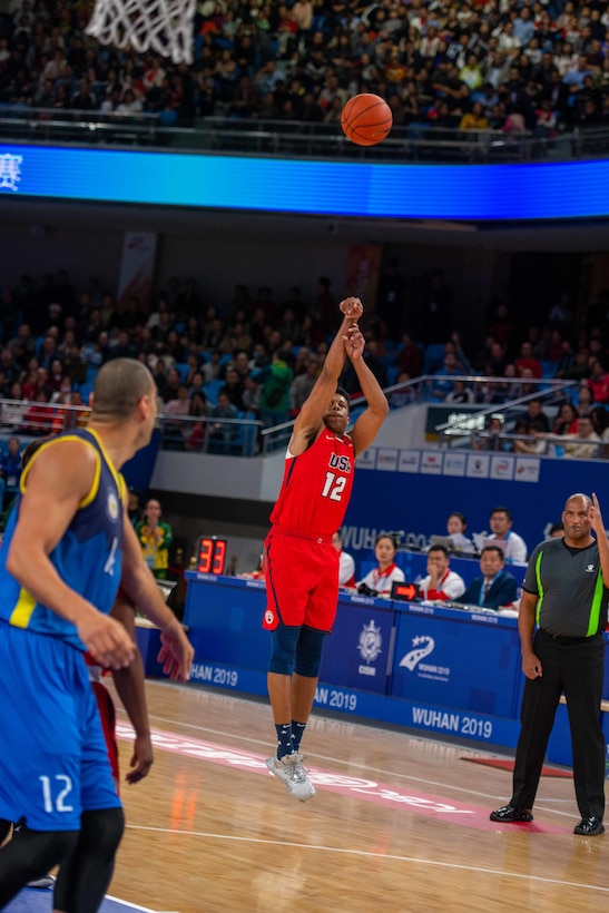 U.S. Navy Lt. Worth Smith, III, U.S Armed Forces Men’s Basketball Team member, shoots a jumper during the 7th Conseil International du Sport Militaire World Games in Wuhan, China Oct. 25, 2019. The U.S. team defeated Brazil 78-61 to advance to the gold medal game against the Lithuania. (U.S. DoD photo by Staff Sgt. Vito T. Bryant)